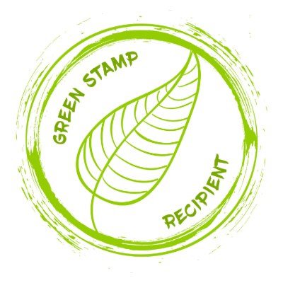 The image shows a green circular stamp with a leaf design, featuring the words "Green Stamp Recipient" around the edge, indicating environmental recognition.