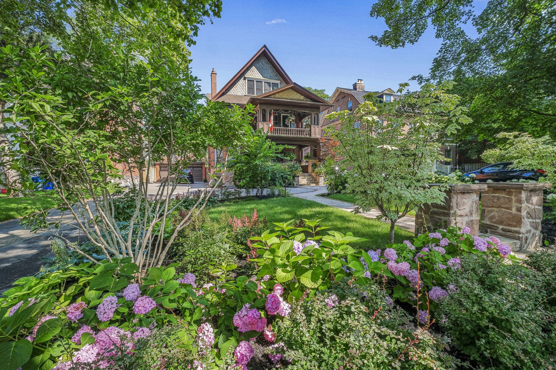 Front yard landscaping in Toronto with beautiful flowers.