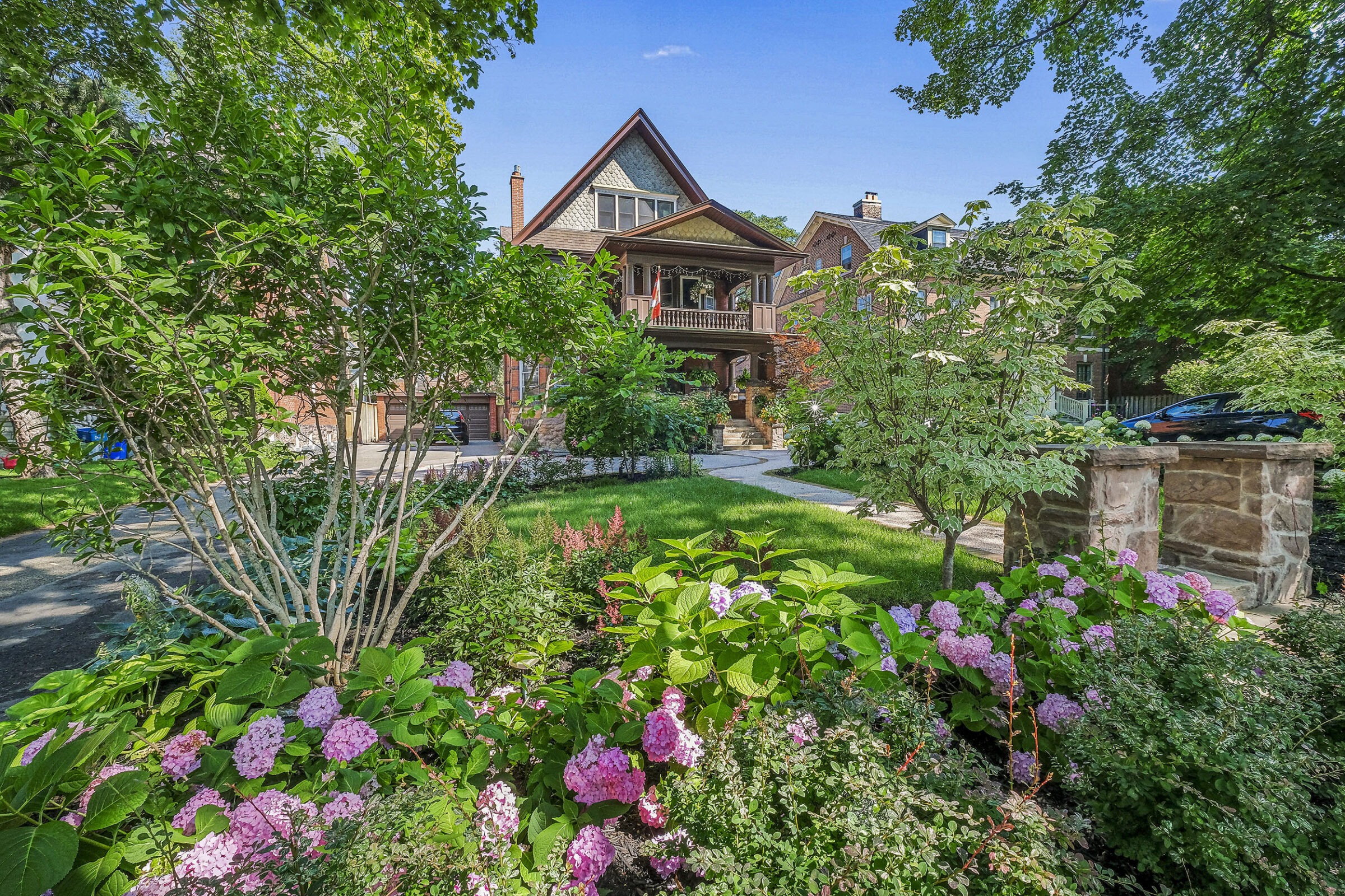 Front yard landscaping in Toronto with beautiful flowers.
